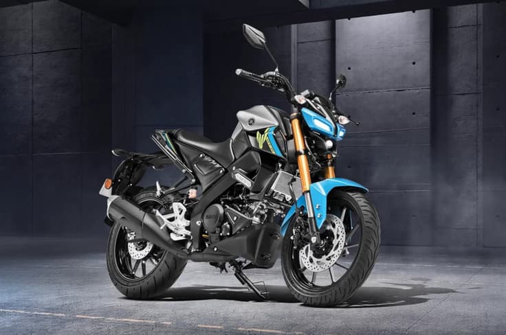 The MT-15 is a sporty street naked based on the Yamaha R15. Yamaha MT15 metallic silver cyan colour front right side static image in garage